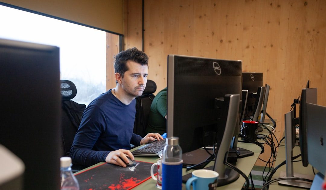 modern developer at desk with AI coding assistant floating above screen