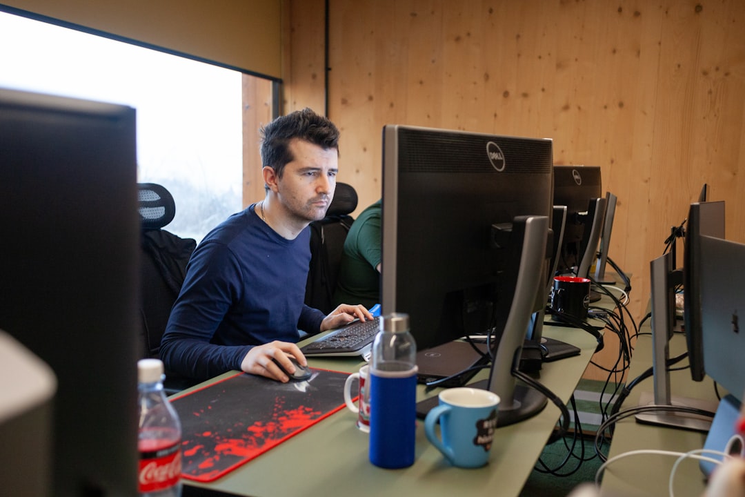 modern developer at desk with AI coding assistant floating above screen
